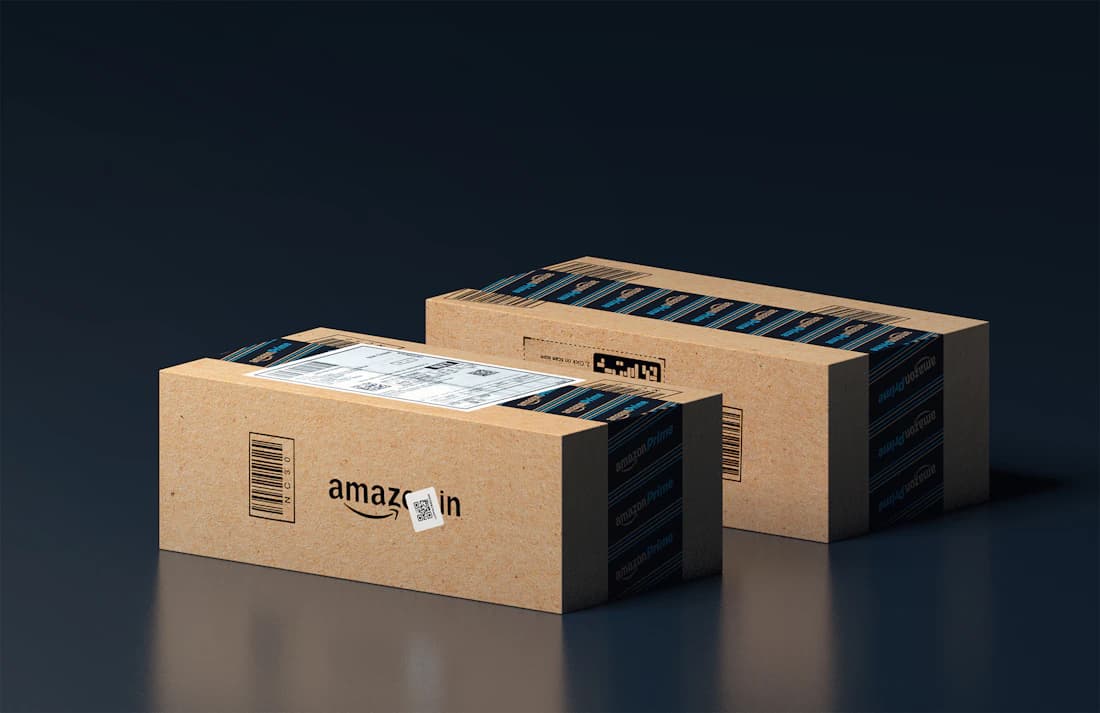 Amazon-branded shipping boxes, a live seller account.